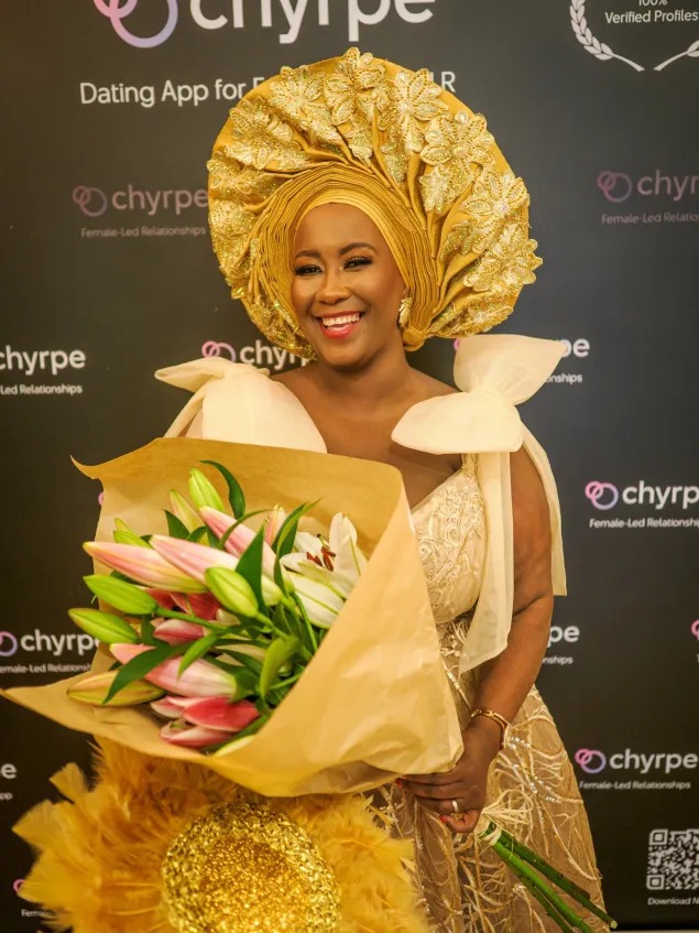 Madame Caramel at the Femdomball, Chyrpe logo in the background